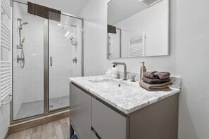 Shower, hair dryer, towels, shampoo