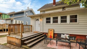 A house with a porch, a bench, and a small table. - The Ohio State of Mind - OSU-Themed 5BR Home in Clintonville (Columbus)
