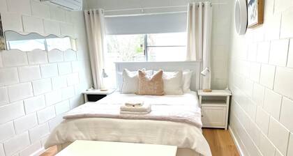 Family Beach Stay with Ocean Glimpses 2 mins walk to beach