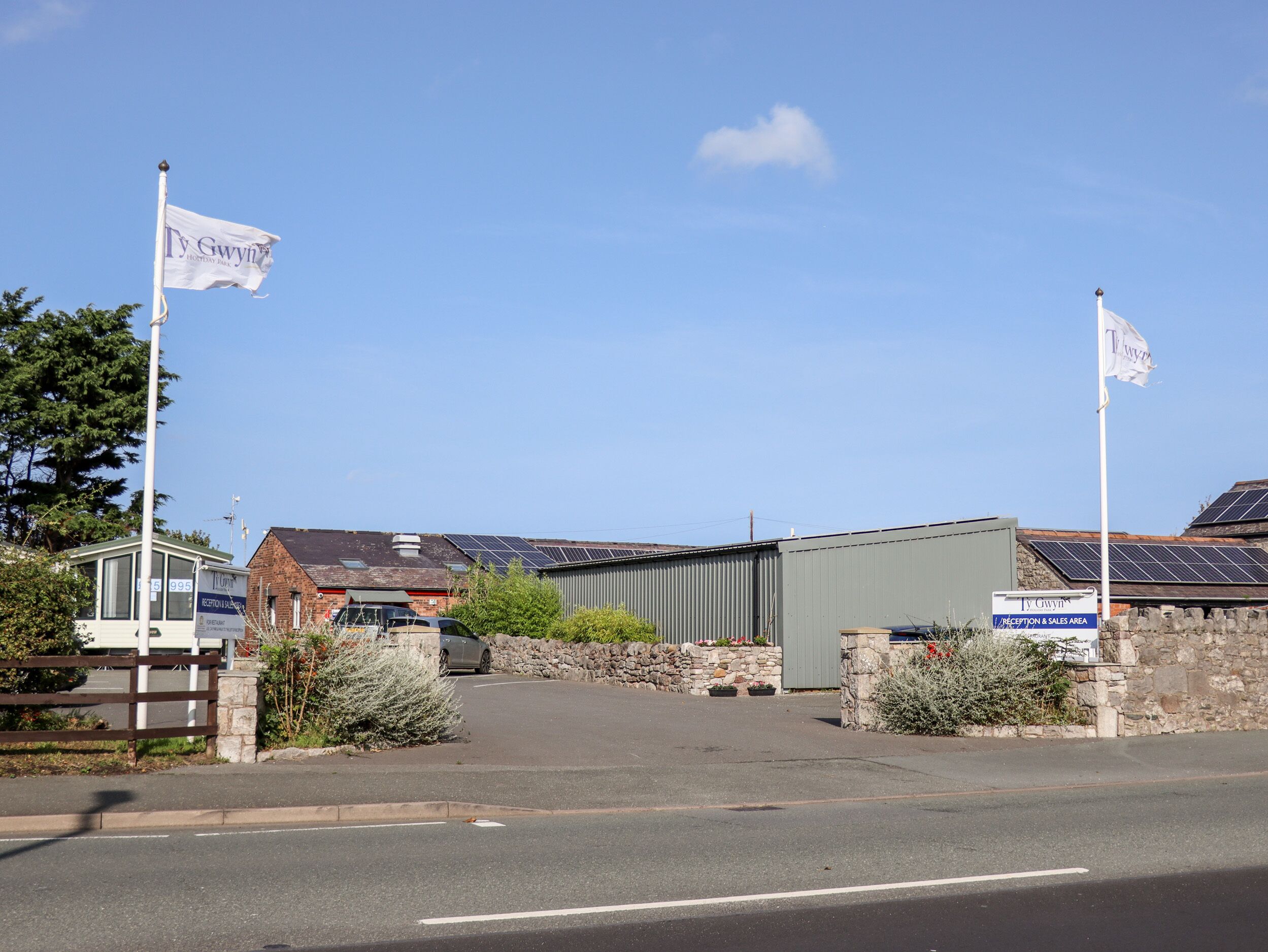 A building with a reception area and solar panels on the roof.