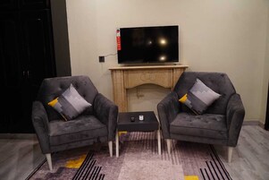 Executive Suite | Living area | 45-inch LED TV with cable channels