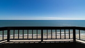 A balcony with a view of the ocean and beach. - Waterside Paradise: Spacious Suite 10th Floor (Myrtle Beach)