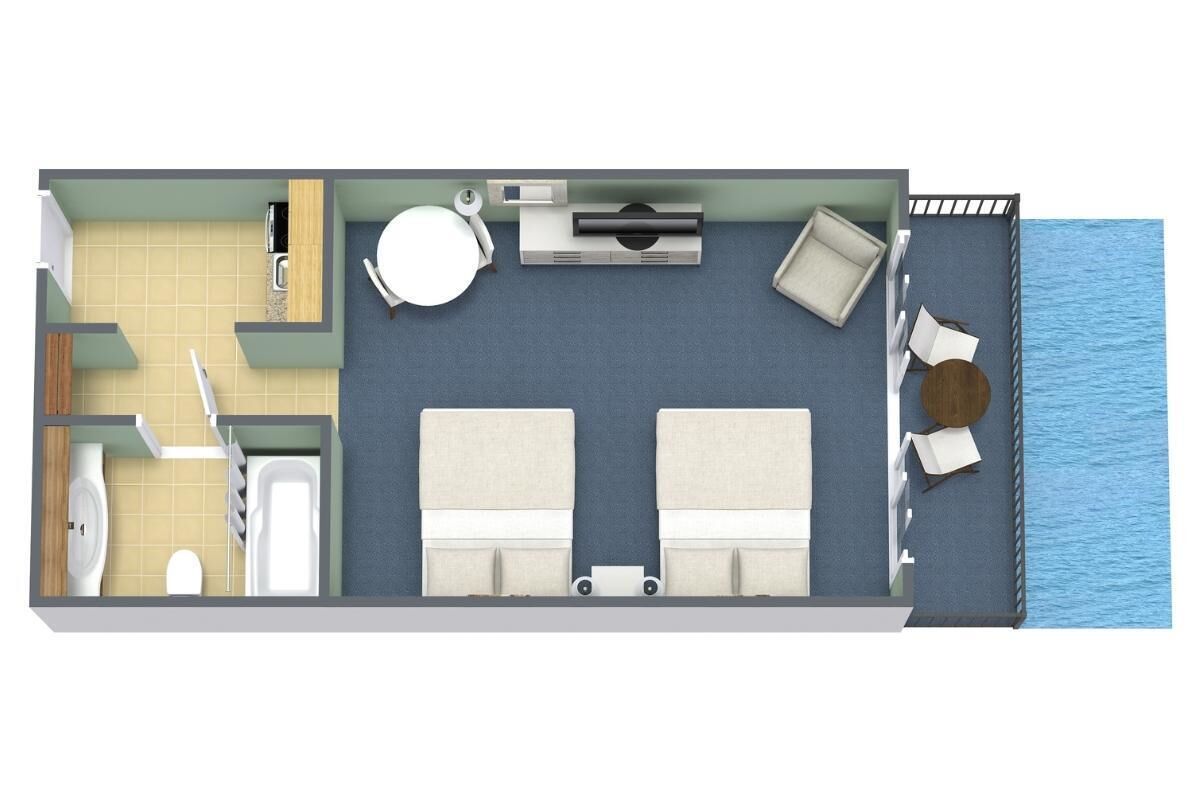 A room with a bed, a desk, a chair, a small table, and a window overlooking the sea.