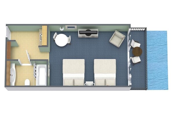 Une chambre avec un lit, une petite table, une chaise, un lavabo et une fenêtre donnant sur la mer.