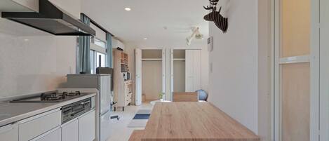 Fridge, microwave, stovetop, coffee/tea maker