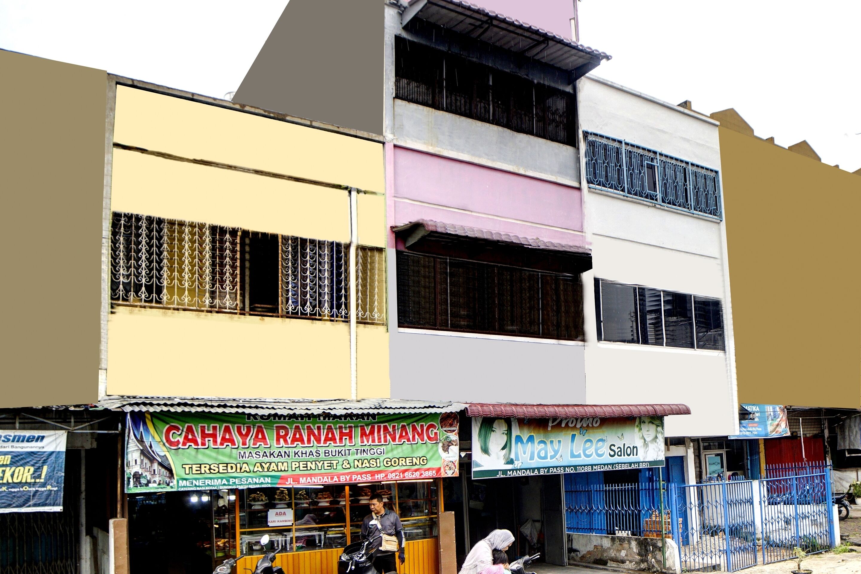 A multi-story building with various shops on the ground floor, including a visible salon and a food stall.