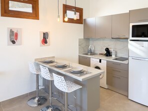 Fridge, microwave, stovetop, coffee/tea maker