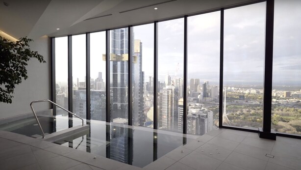 A modern interior with large windows offering a city view. - Panoramic Paradise , Parking & Amenities (Southbank)