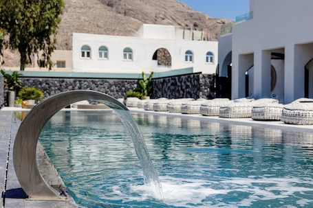Seasonal outdoor pool, open 9:00 AM to 8:00 PM, pool umbrellas