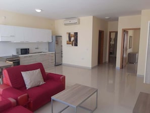 Apartamento | Zona de estar | Una televisión de pantalla plana