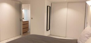 1 bedroom, desk, iron/ironing board, travel crib