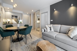 Family Apartment | Living area | 37-inch flat-screen TV with cable channels, streaming services