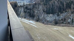A view from a balcony overlooking a mountainous landscape with a power line tower. - Gasthof Lublass (Matrei in Osttirol)