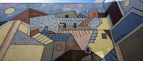 A mosaic artwork with geometric shapes and patterns.