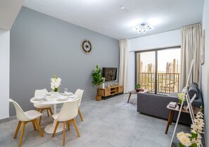 Design Apartment | Living area | 50-inch Smart TV with cable channels, Netflix, streaming services - Tanin-Beautiful and Modern Apartment with Huge Space (Dubai)