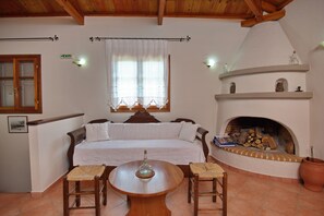 House | Living area | 28-inch flat-screen TV with digital channels, fireplace - Likavgies Comfort Maisonettes (Alonissos)
