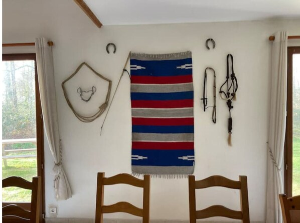 Relax in a serene space with a comfortable seating area and a large window with curtains.