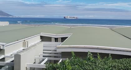 On the beach cabana at Bloubergstrand! Sea view of Robben Island and Cape Town.