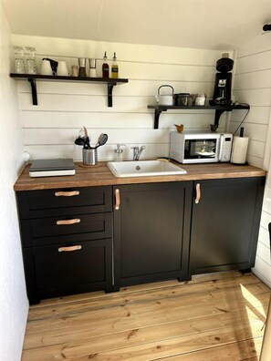 Fridge, microwave, stovetop, coffee/tea maker