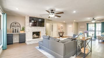 TV, fireplace, books