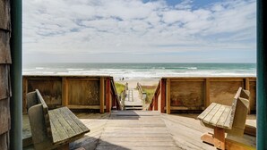 A wooden boardwalk leading to a beach with a clear view of the ocean. - Oceanfront Watsonville Condo w/ Beach Access! (Watsonville)
