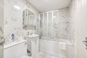 Bathtub, hair dryer, towels