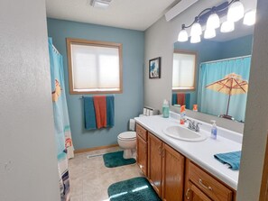 Bathtub, hair dryer, towels
