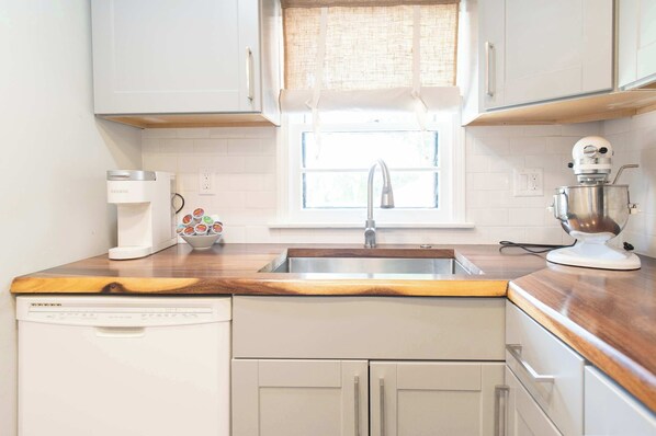Condo, 1 Double Bed, Kitchen, Garden View (The Opening Act) | Private kitchen | Fridge, microwave, oven, stovetop