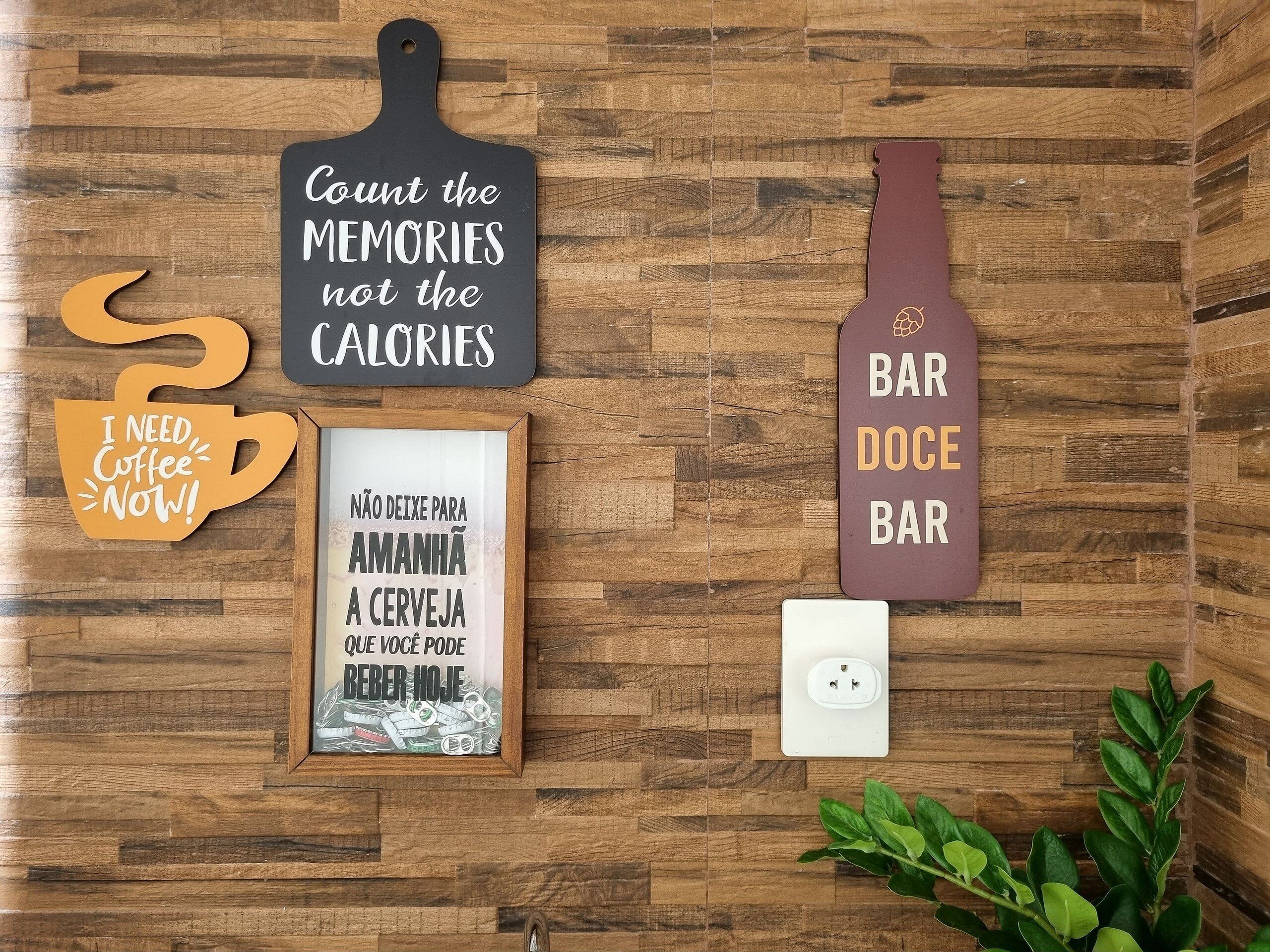 A wooden wall with various signs and a framed picture.