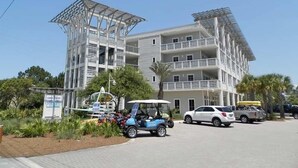 A multi-story building with a modern architectural design, featuring balconies and large windows. - Cassine Station #305 by Southern Vacation Rentals (Santa Rosa Beach)