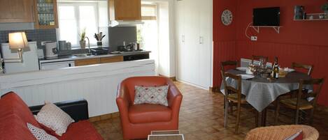 A compact living space with a kitchen, dining area, and seating area.