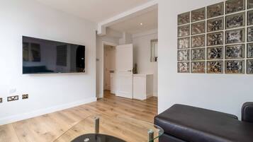 Basic Apartment, 1 Double Bed | Living area | TV