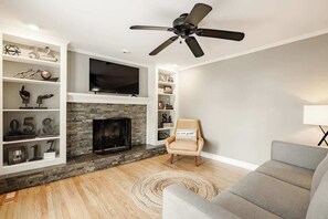 TV, fireplace, books, offices