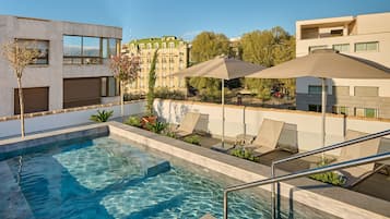 Relax by the rooftop pool with a stunning view of the city.