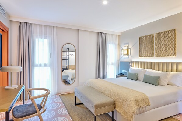 Luxe beddengoed, een minibar, een kluis op de kamer, een bureau