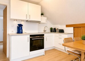 Coffee/tea maker, fridge, microwave, oven