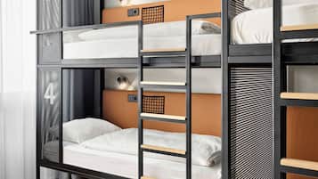 Cozy multi-level bunk bed room with a reading light on the lower bunk.