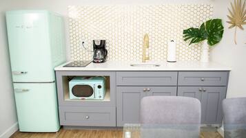 Fridge, microwave, cookware/dishes/utensils