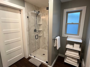 Shower, hair dryer, towels, soap