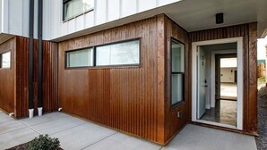 A modern building with a wooden facade and large windows. - Rooftop Lounge ~ Sleeps 12 ~4 bed (Nashville)