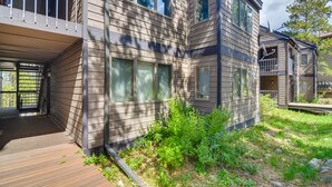 A modern multi-story house with a covered porch and a small garden area. - 6 Mi to Winter Park: Mtn-View Condo w/ Balcony! (Fraser)