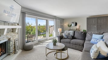 Smart TV, fireplace, books, computer monitors