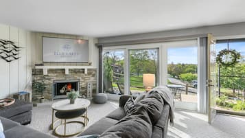 Smart TV, fireplace, books, computer monitors