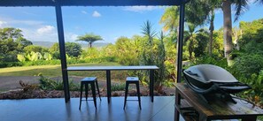 Outdoor dining - NEW -The Sugar Shack, Ocean views over cane fields from your outdoor Spa Bath  (Miallo)