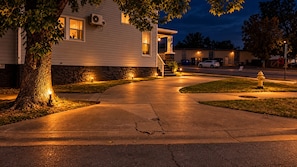 A residential driveway leading to a house with a stone wall and a tree. - The vampire's den, downtown big house, pets ok (Fort Smith)