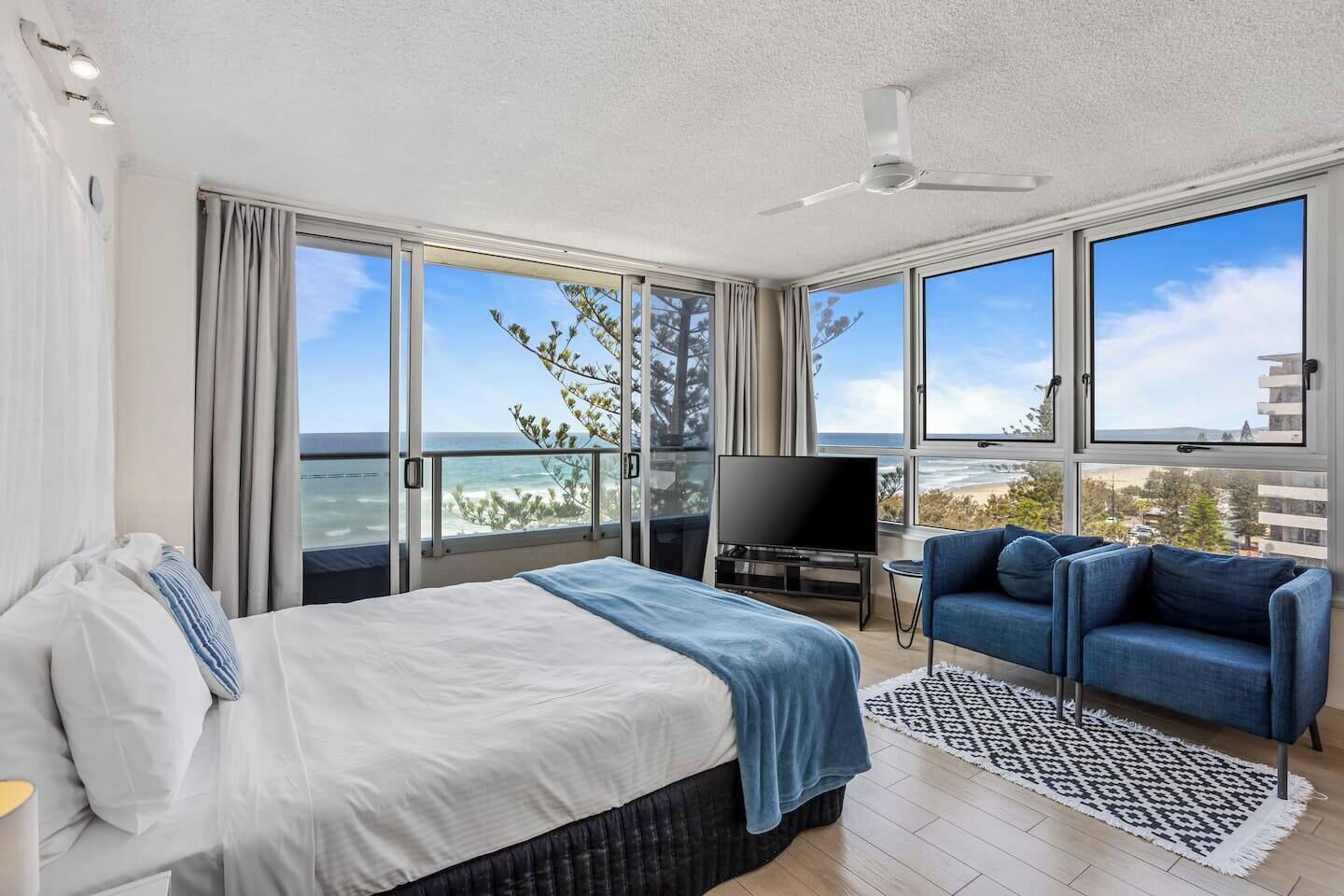 Wake up to breathtaking views across the ocean from your plush studio apartment with a charming balconette on the beachfront at Surfers Paradise.