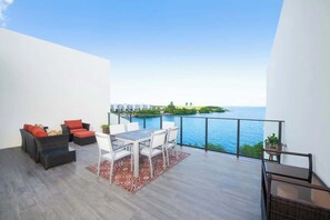 Outdoor dining - Allure #22 Three Bedroom Waterfront Condo & Pool (Grand Harbour)