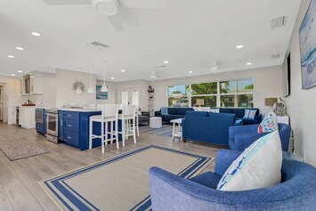 The space flows effortlessly from room to room and is filled with high-end finishes and upgrades throughout.