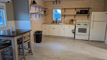 Coffee/tea maker, fridge, microwave, oven