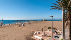 A beach with a lifeguard tower, sun loungers, and a clear view of the sea. - Beachfront Nasas 4 JM by Interhome (San Agustín)